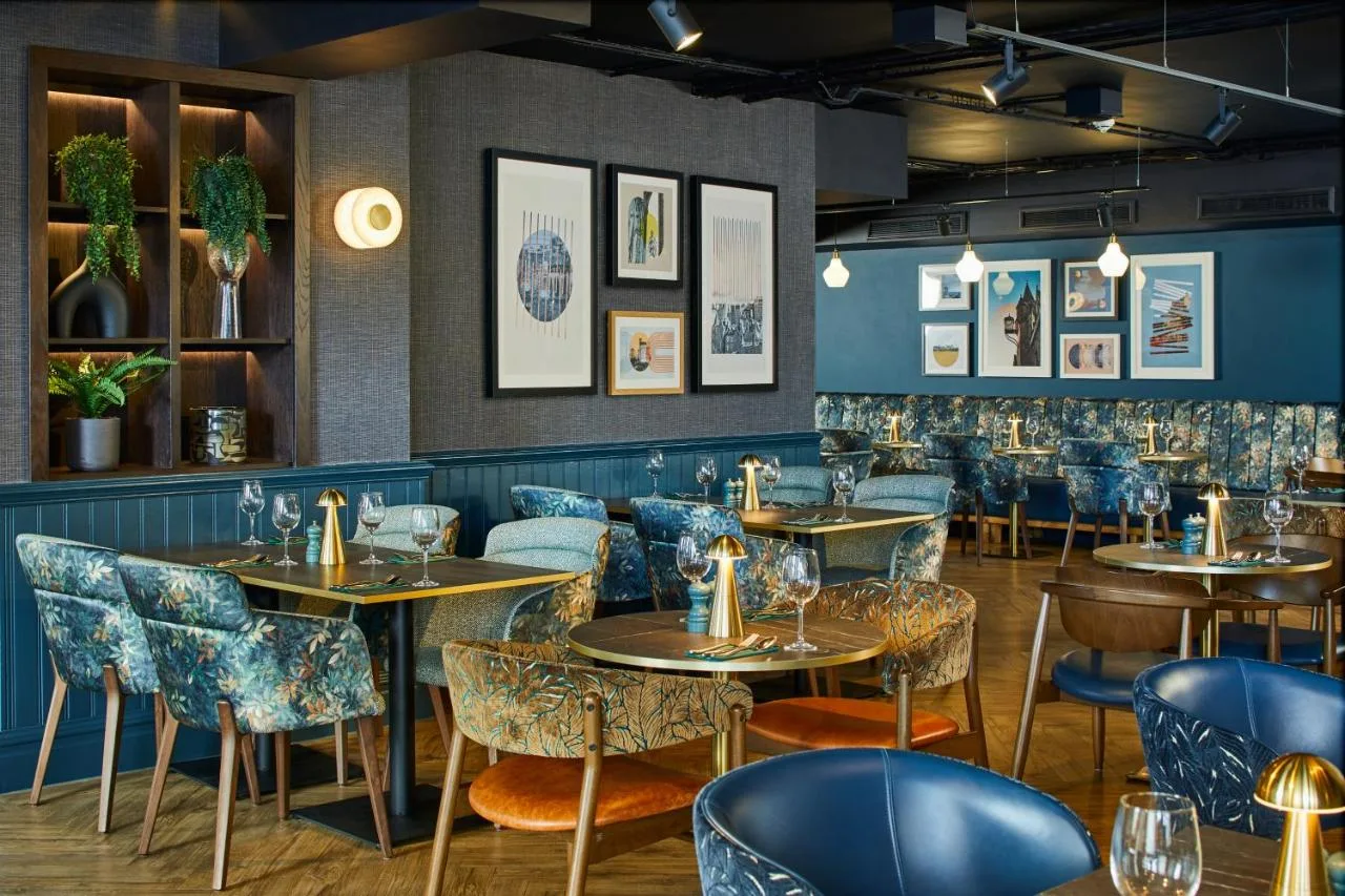 Restaurant with tables and chairs at Leonardo Royal Hotel Edinburgh, Old Town