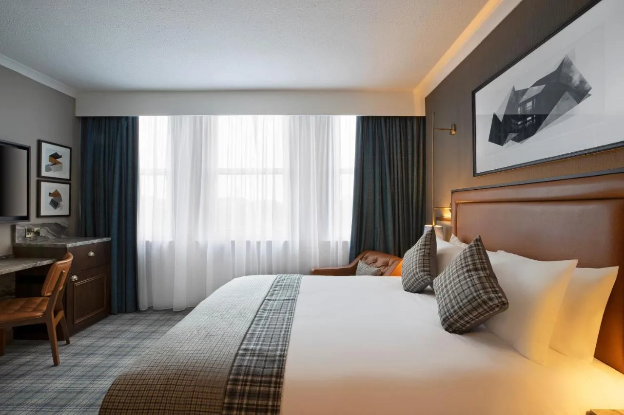 Hotel room with bed and work desk at Leonardo Royal Hotel Edinburgh